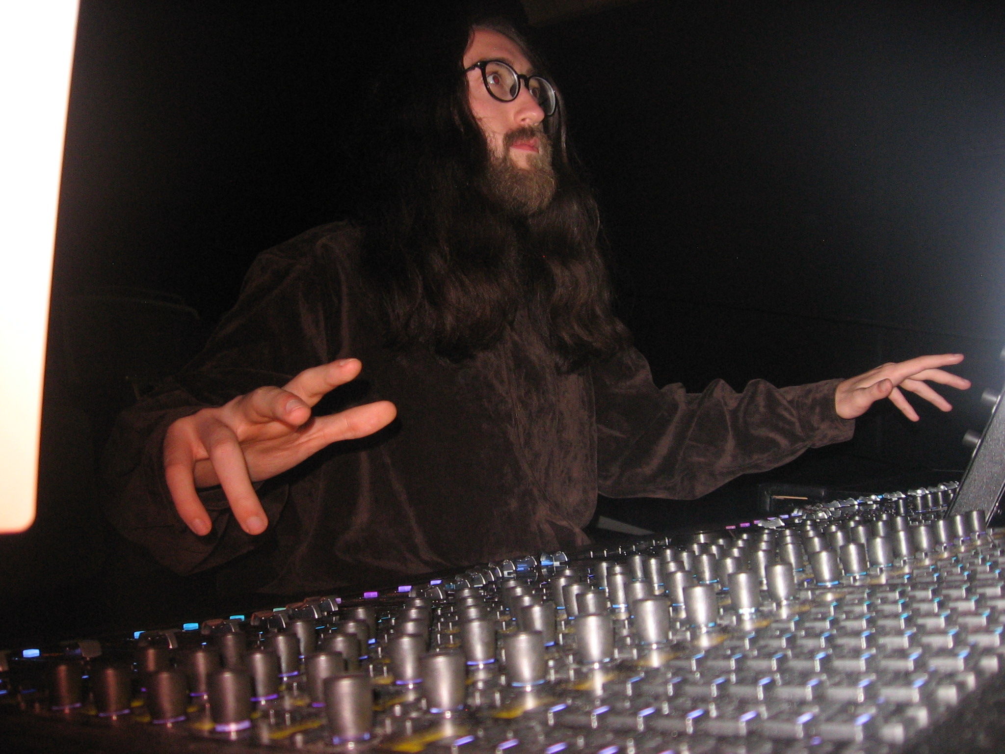 Dylan at the Avid S6 mixing console, photographed from a low angle